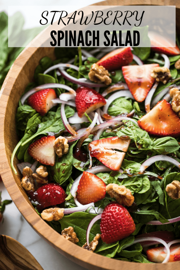 Strawberry and Spinach salad in a wooden bowl