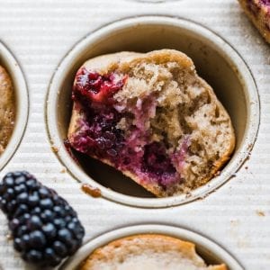 blackberry muffin in a muffin tin