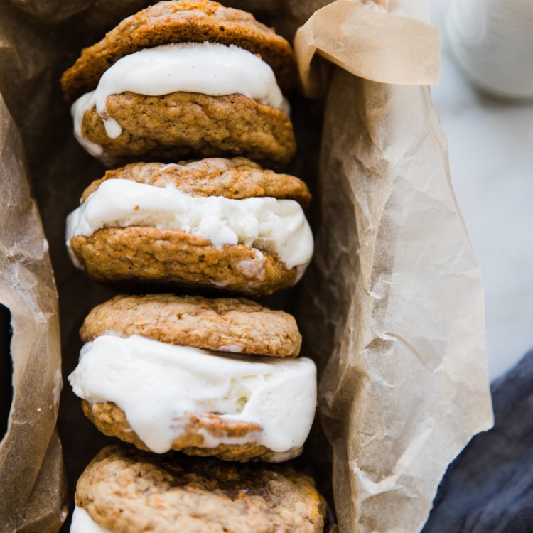 carrot cake ice cream sandwiches on parchment paper