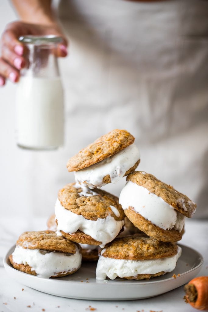 carrot cake ice cream sandwiches stacked together on a white plate