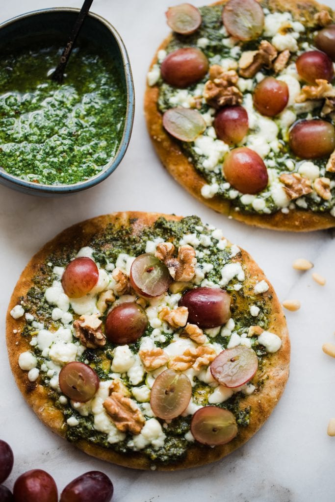 pita bread with kale pesto, cheese and grapes