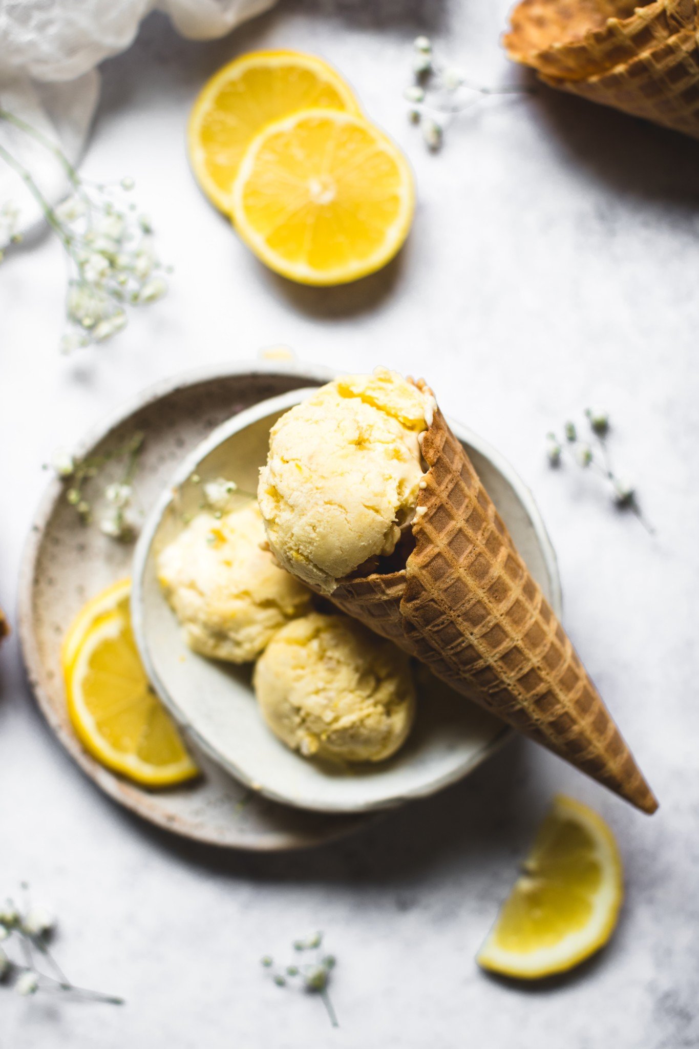 Lemon ice cream in a waffle ice cream cone