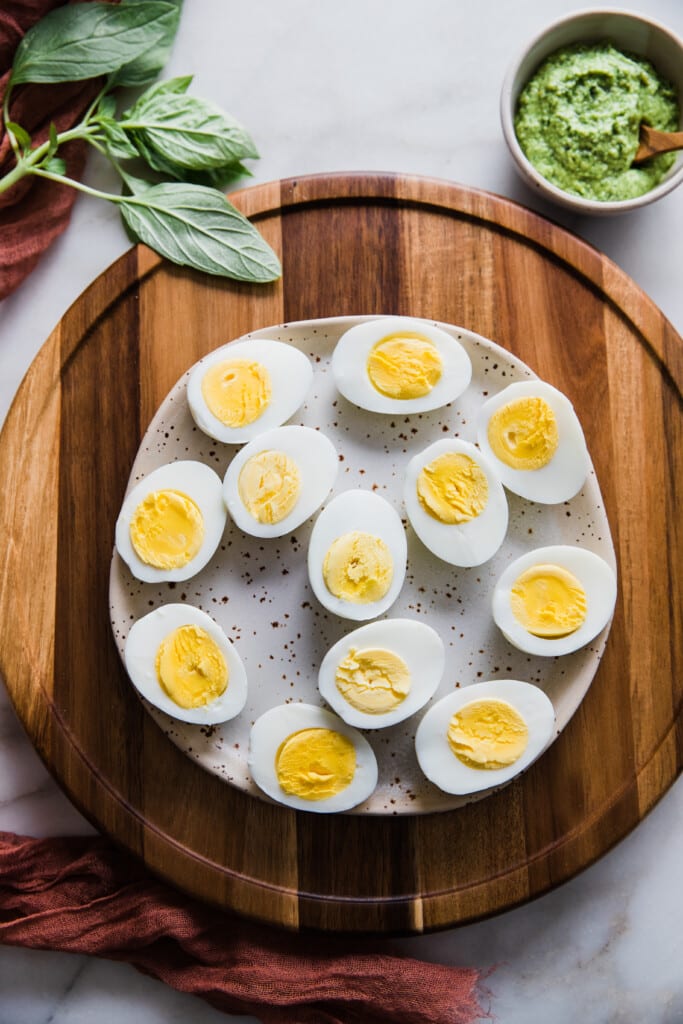 hard boiled eggs sliced in half on a plate