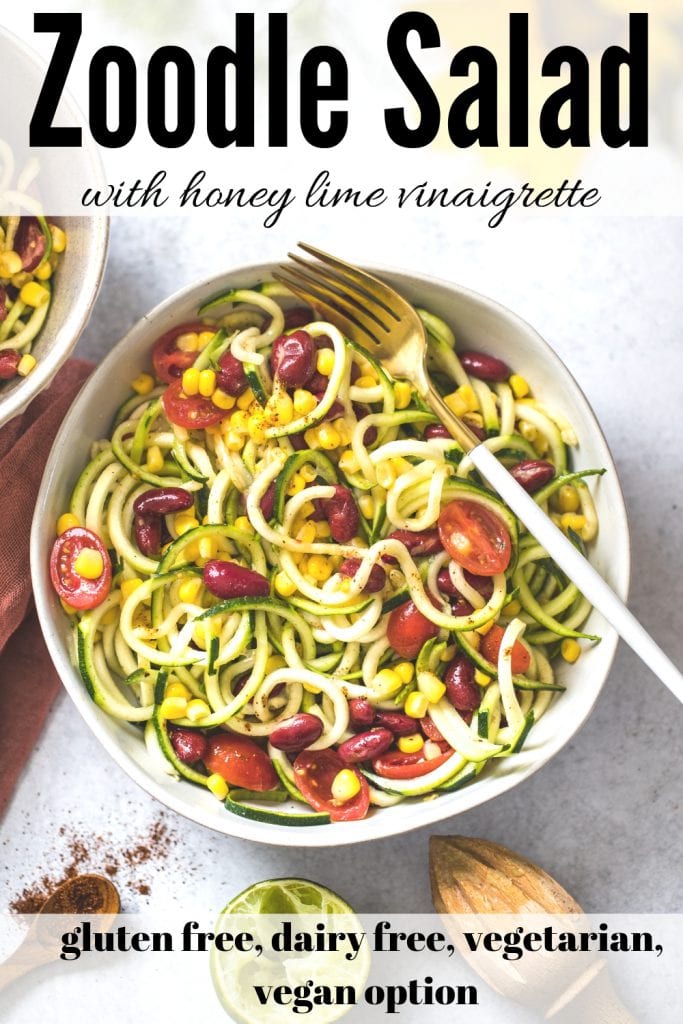 zoodle salad with corn in a white bowl