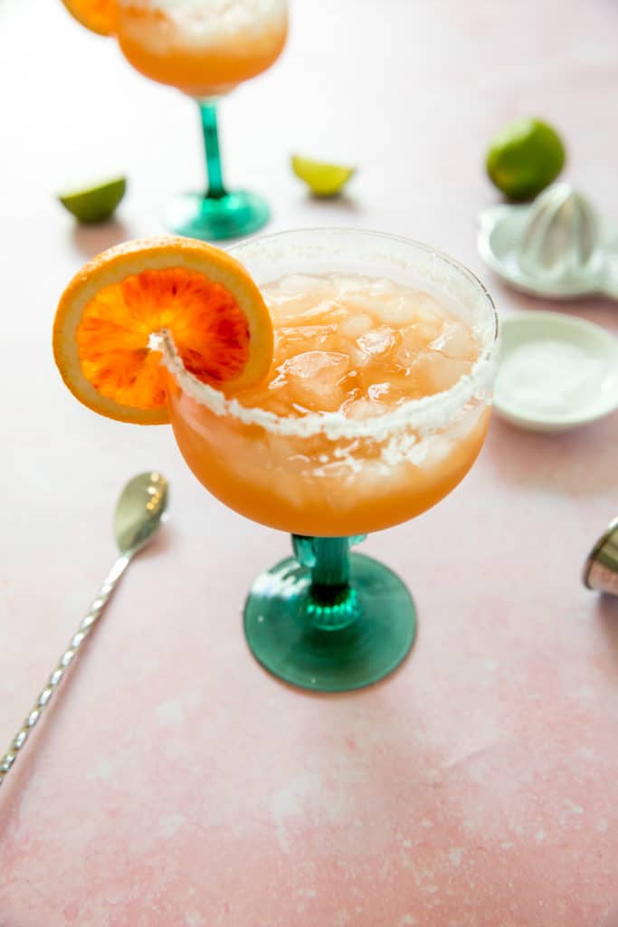 blood orange margarita in a margarita glass