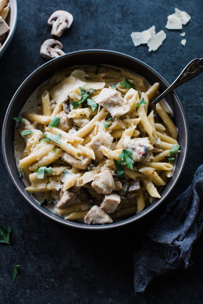 chicken and penne noodles in a bowl