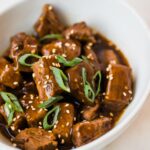 steak bites in a white bowl