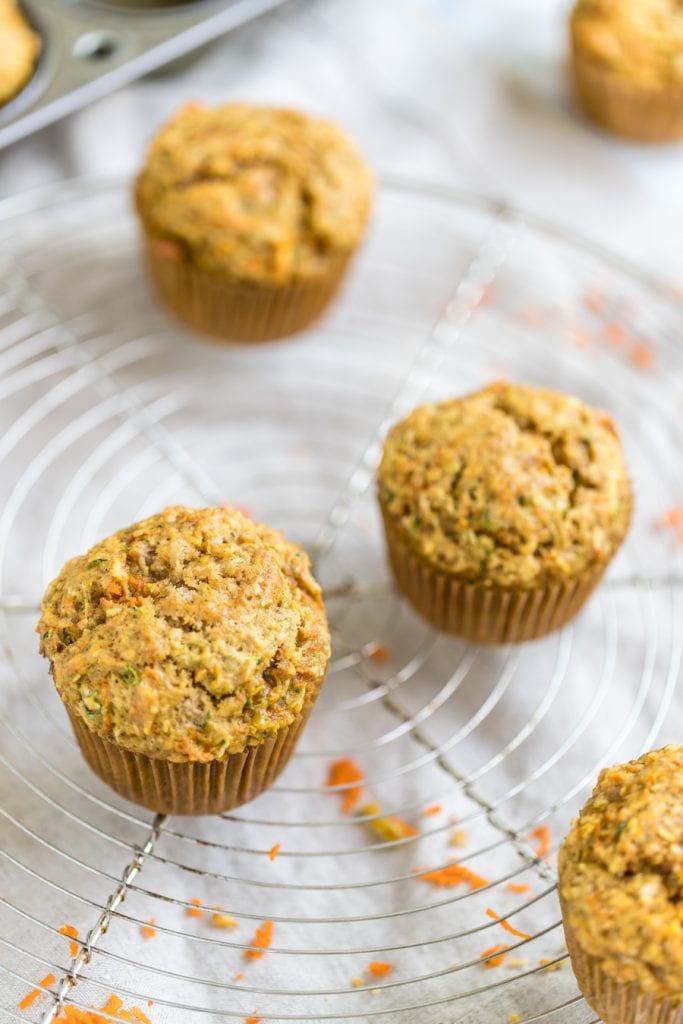 zucchini carrot muffin on a cooling rack