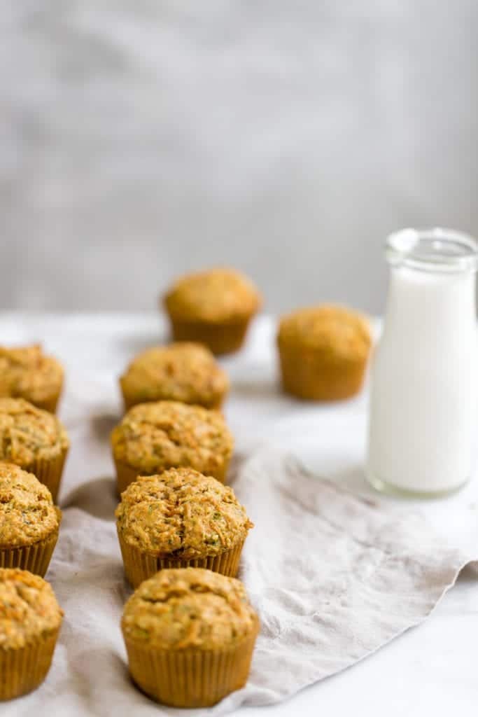 zucchini carrot muffin on a cooling rack