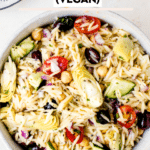 greek orzo pasta salad in a large white bowl