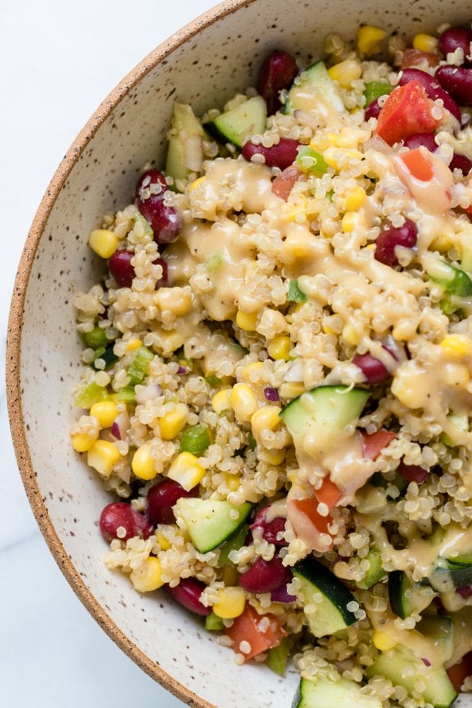 quinoa salad in a tan speckled bowl