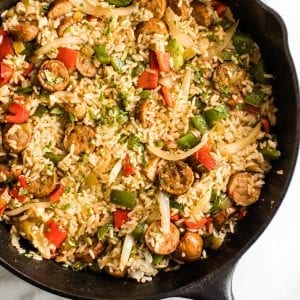 sausage, rice and bell peppers in a cast iron skillet