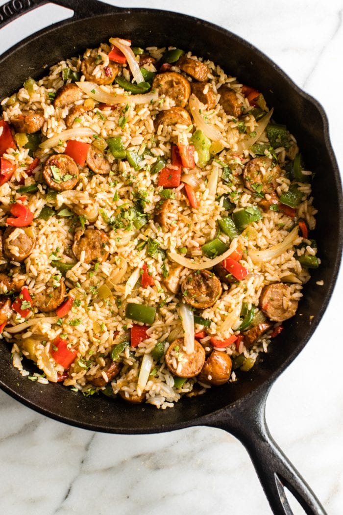 sausage, rice and bell peppers in a cast iron skillet