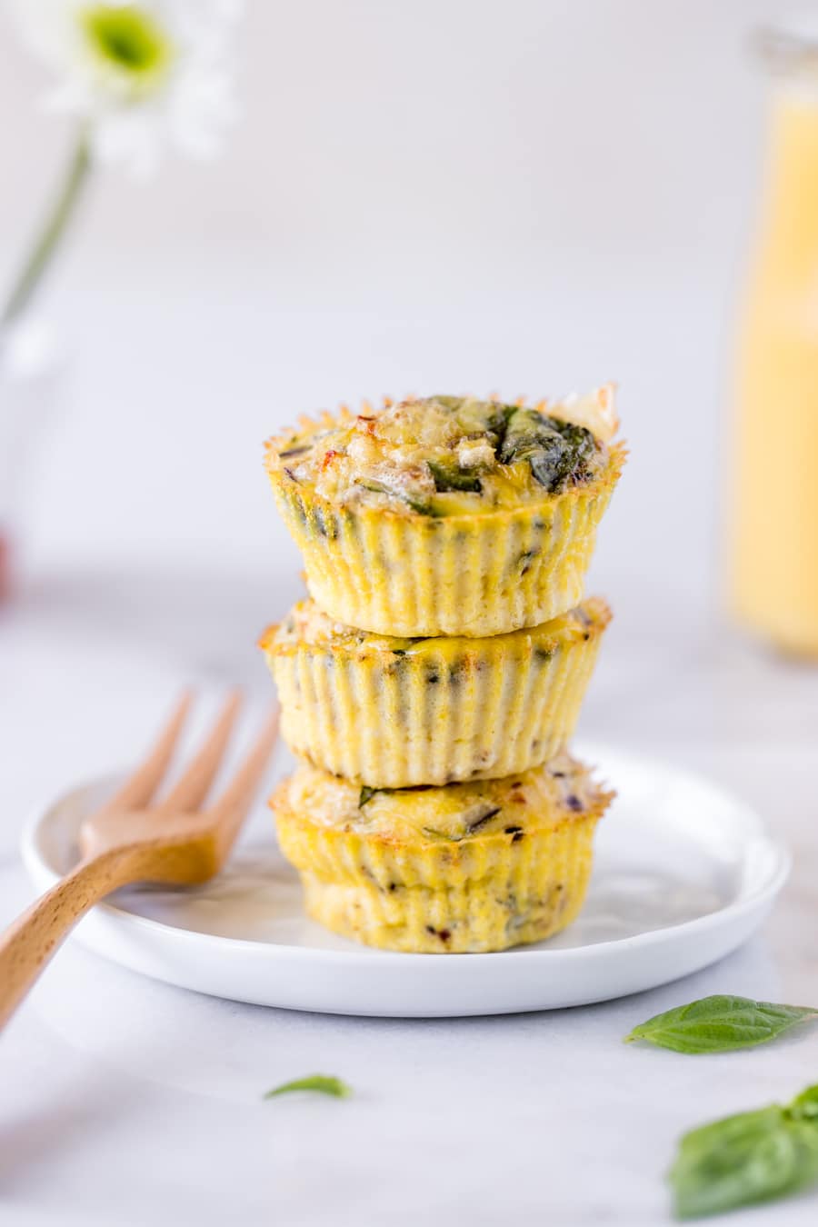 egg muffins stacked on a white plate