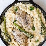 chicken and risotto in a cast iron skillet