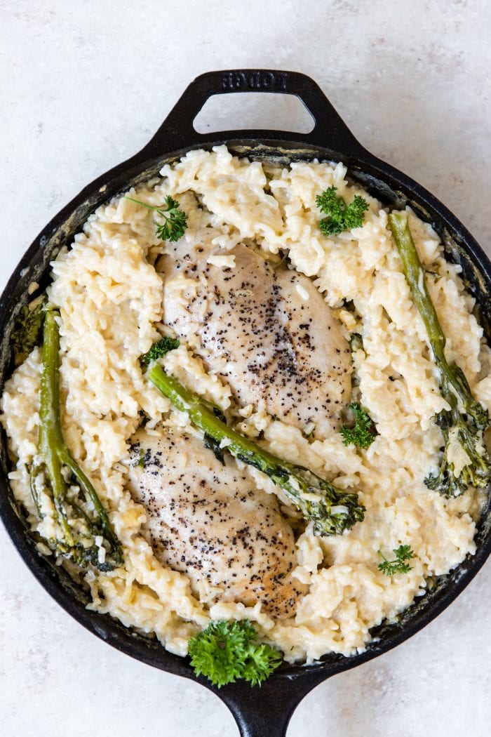 chicken and risotto in a cast iron skillet