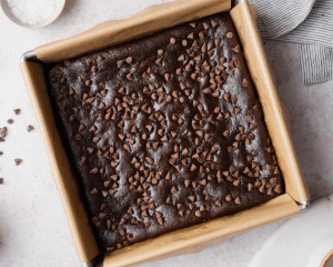 Black bean brownies baked in 8x8 metal pan.