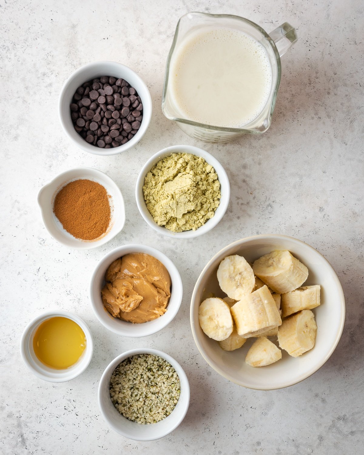 ingredients to make a smoothie in small bowls