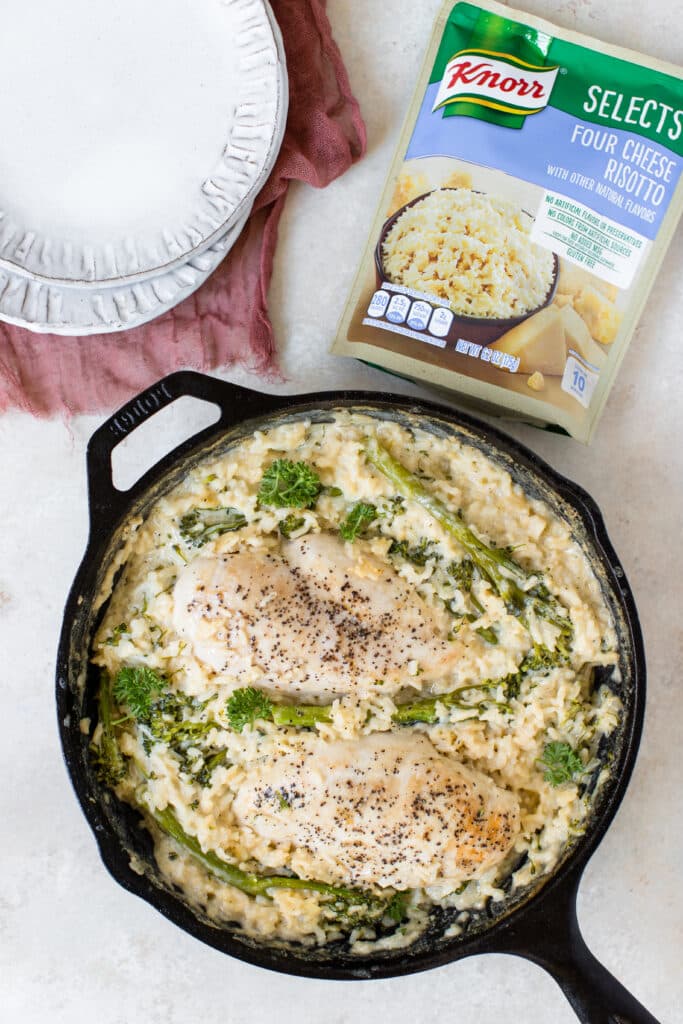 chicken and risotto in a cast iron skillet