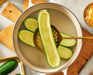 Blanching the zucchini for 1-2 minutes in boiling water.