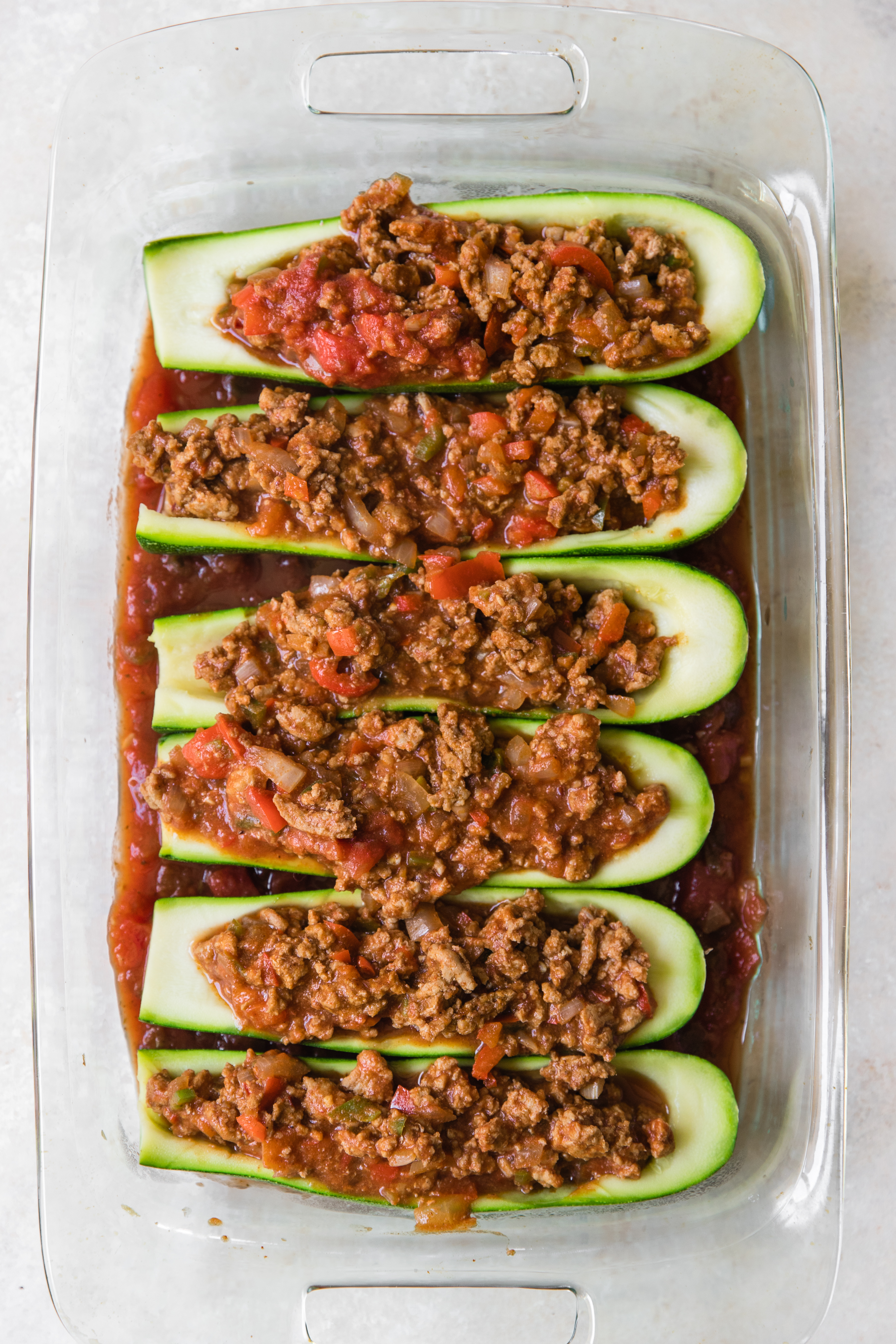 zucchini taco boats in a glass Pyrex dish