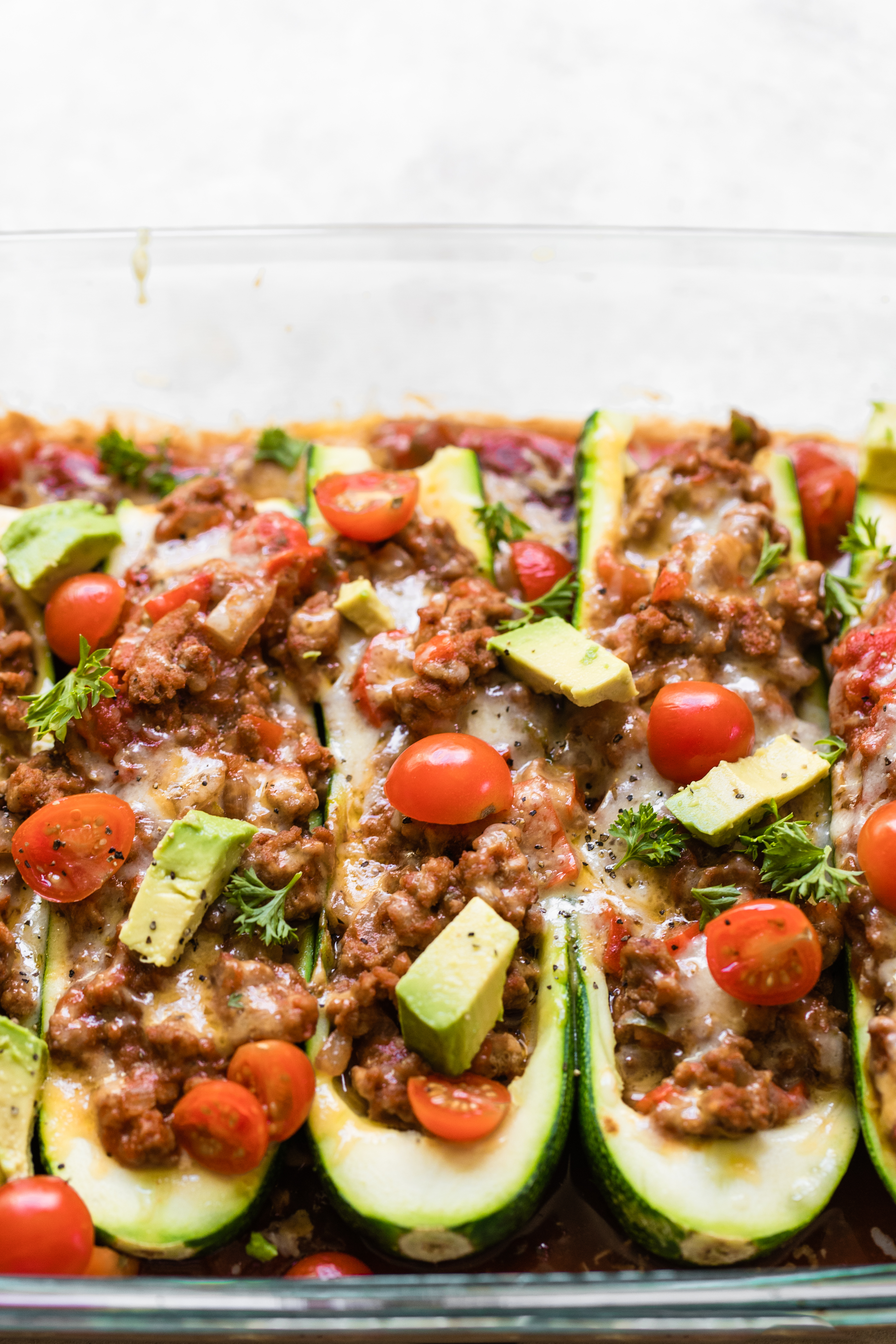 zucchini taco boats in a glass Pyrex dish