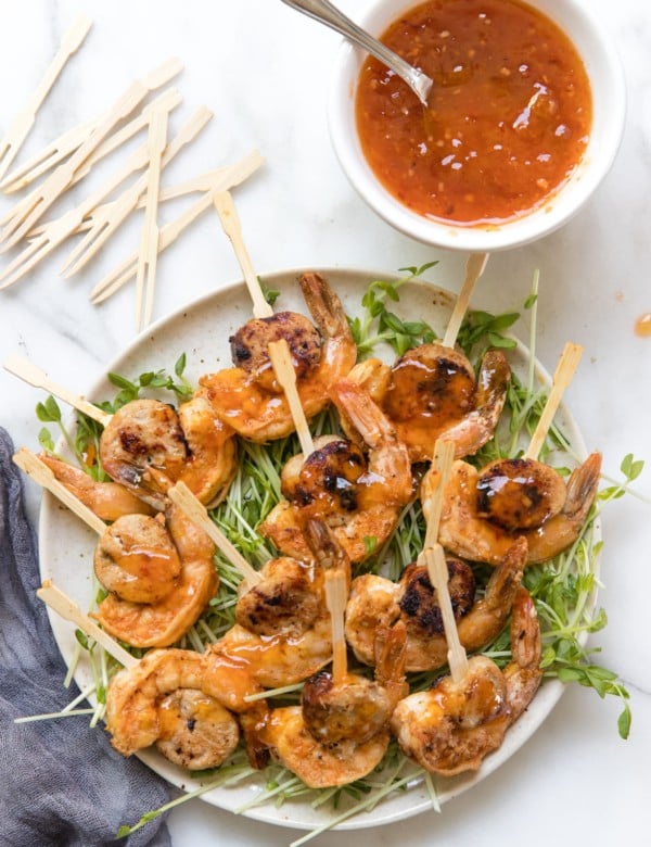 sausage and shrimp on a toothpick with microgreens