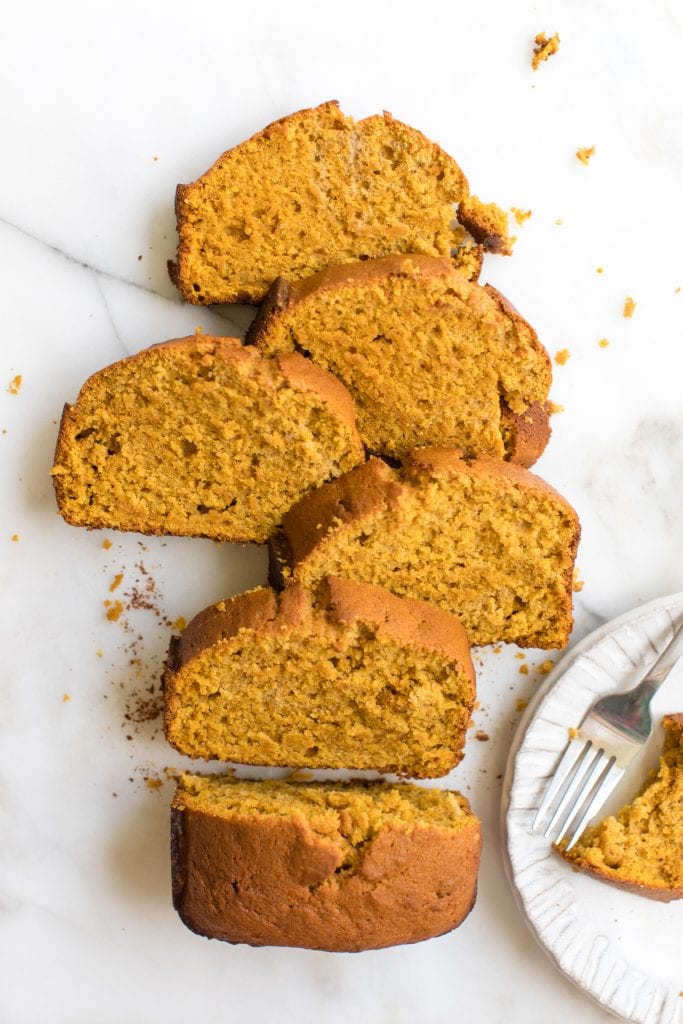 pumpkin pound cake cut up on a marble board