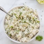 jasmine rice in a bowl with cilantro and lime