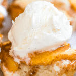 individual peach cobbler topped with vanilla ice cream