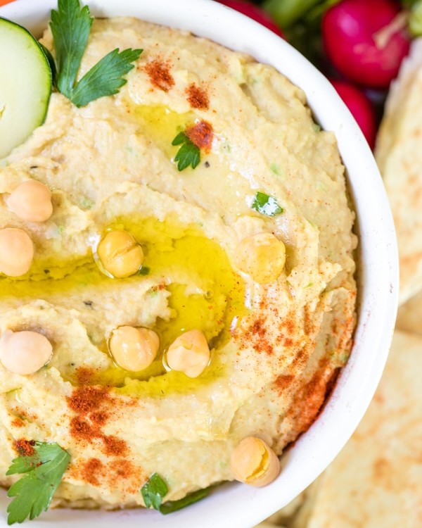 creamy hummus made with tahini in a white bowl