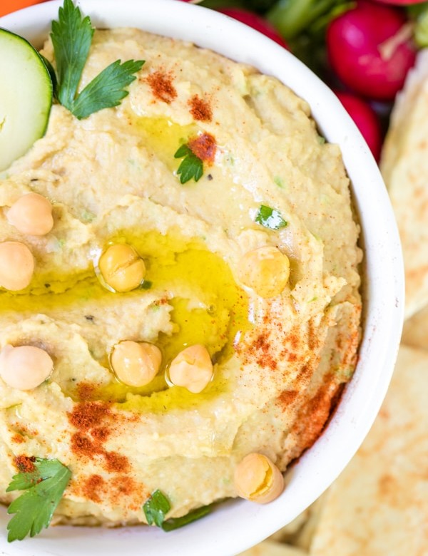 creamy hummus made with tahini in a white bowl