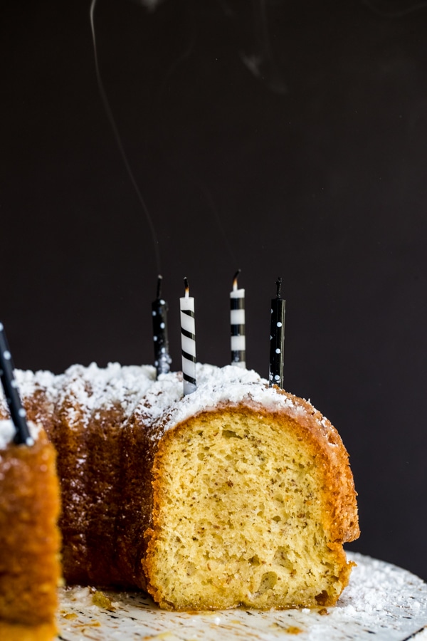 Bacardi rum cake on a cake stand with candles 