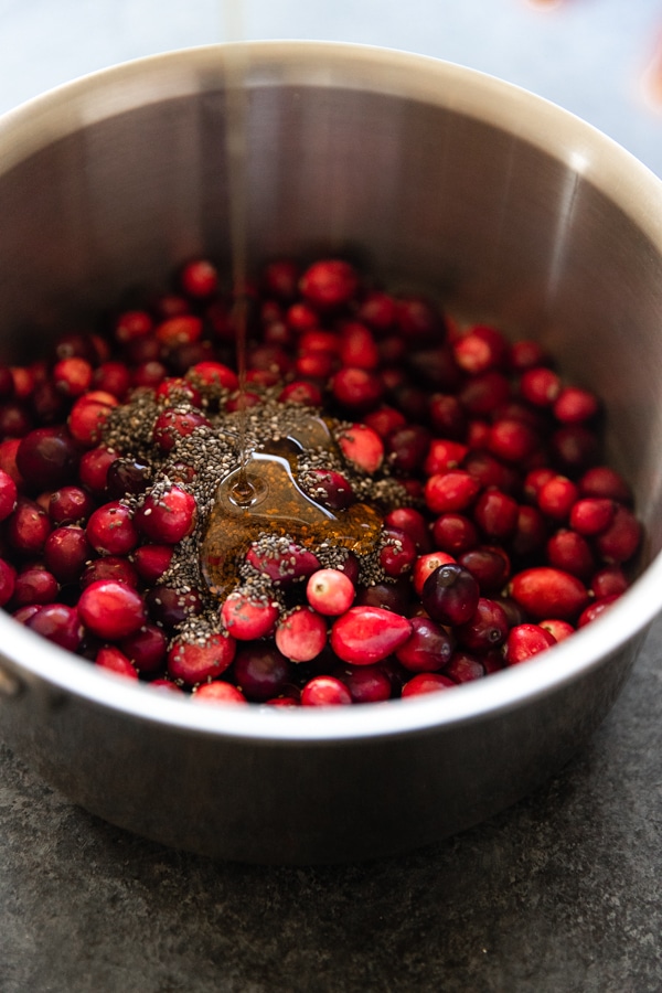 cranberries and chia seeds in a saucepan