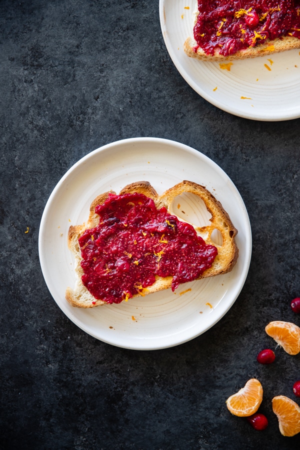 cranberry chia seed jam on sourdough toast on a white plate