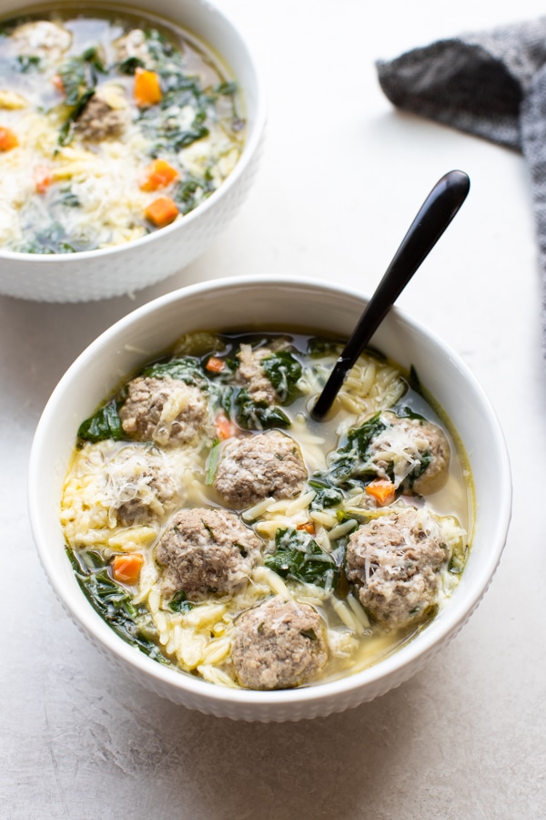 Italian wedding soup in a white bowl