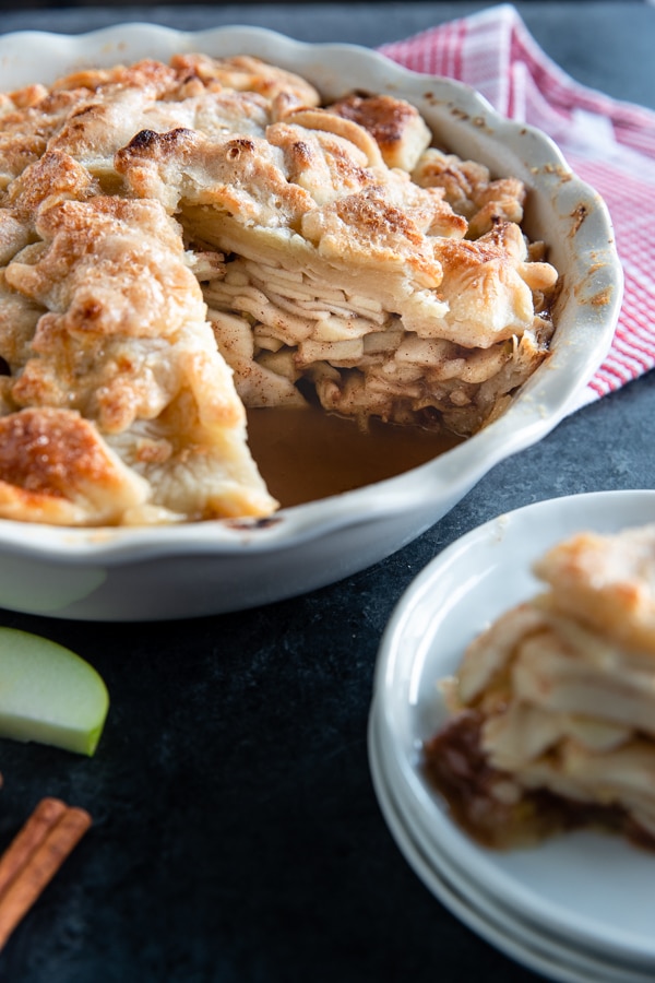 homemade apple pie in a pie pan freshly baked
