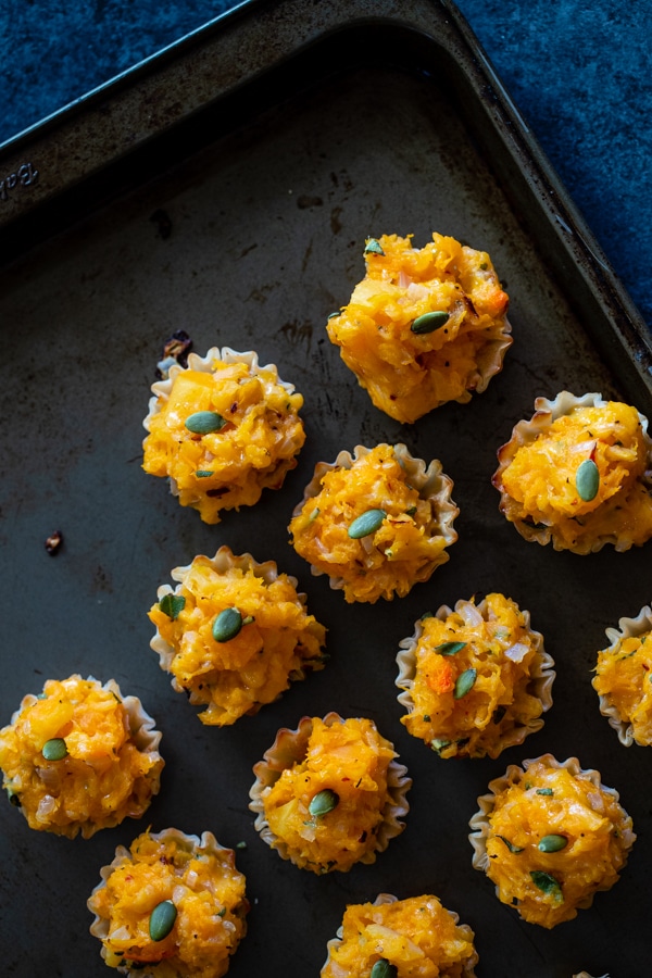 butternut squash bites on a baking sheet