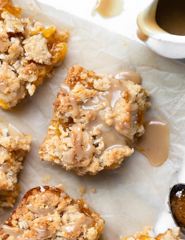 apricot bars made with coconut and drizzled with caramel sauce