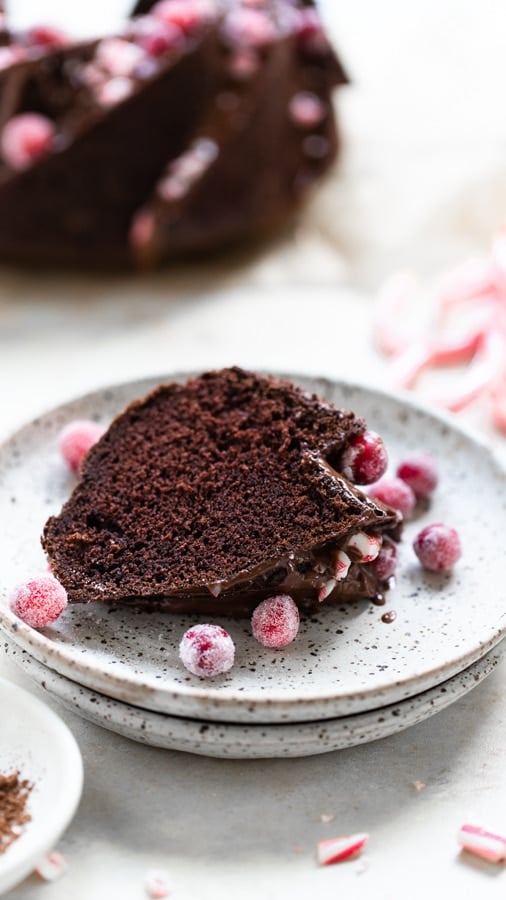 a slice on peppermint chocolate bundt cake on a plate