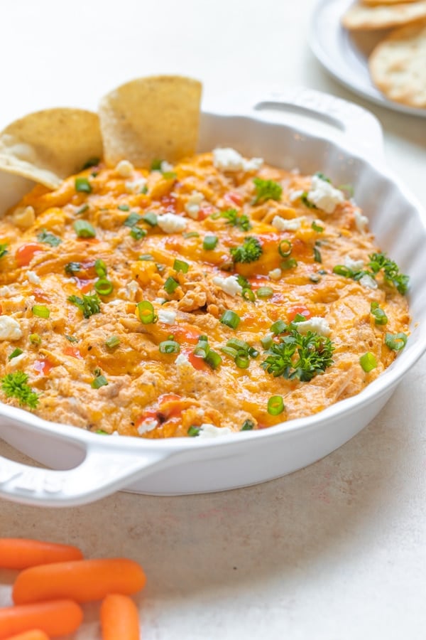 buffalo chicken dip in a white serving dish
