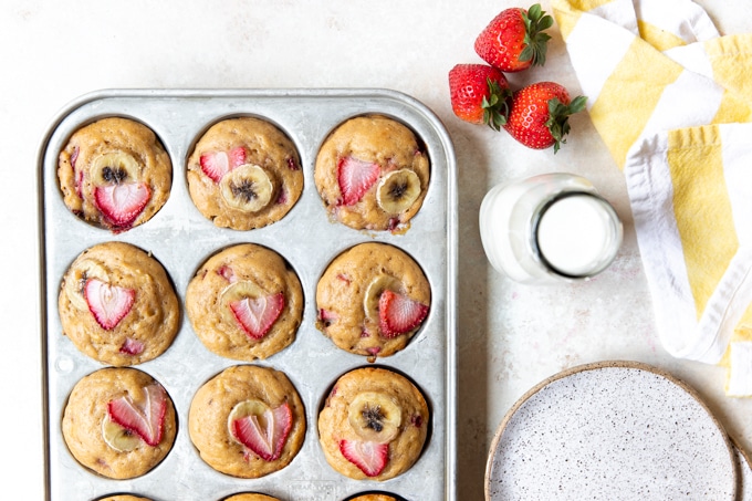strawberry banana muffins in a muffin tin