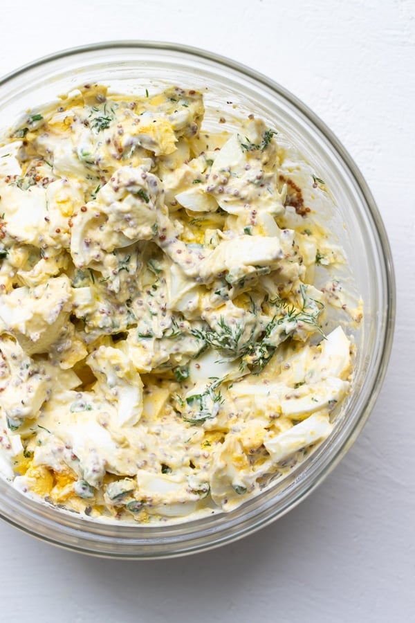 egg salad in a bowl with Dijon mustard and dill