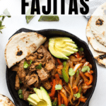 flank steak fajitas with a flour tortilla topped with cilantro