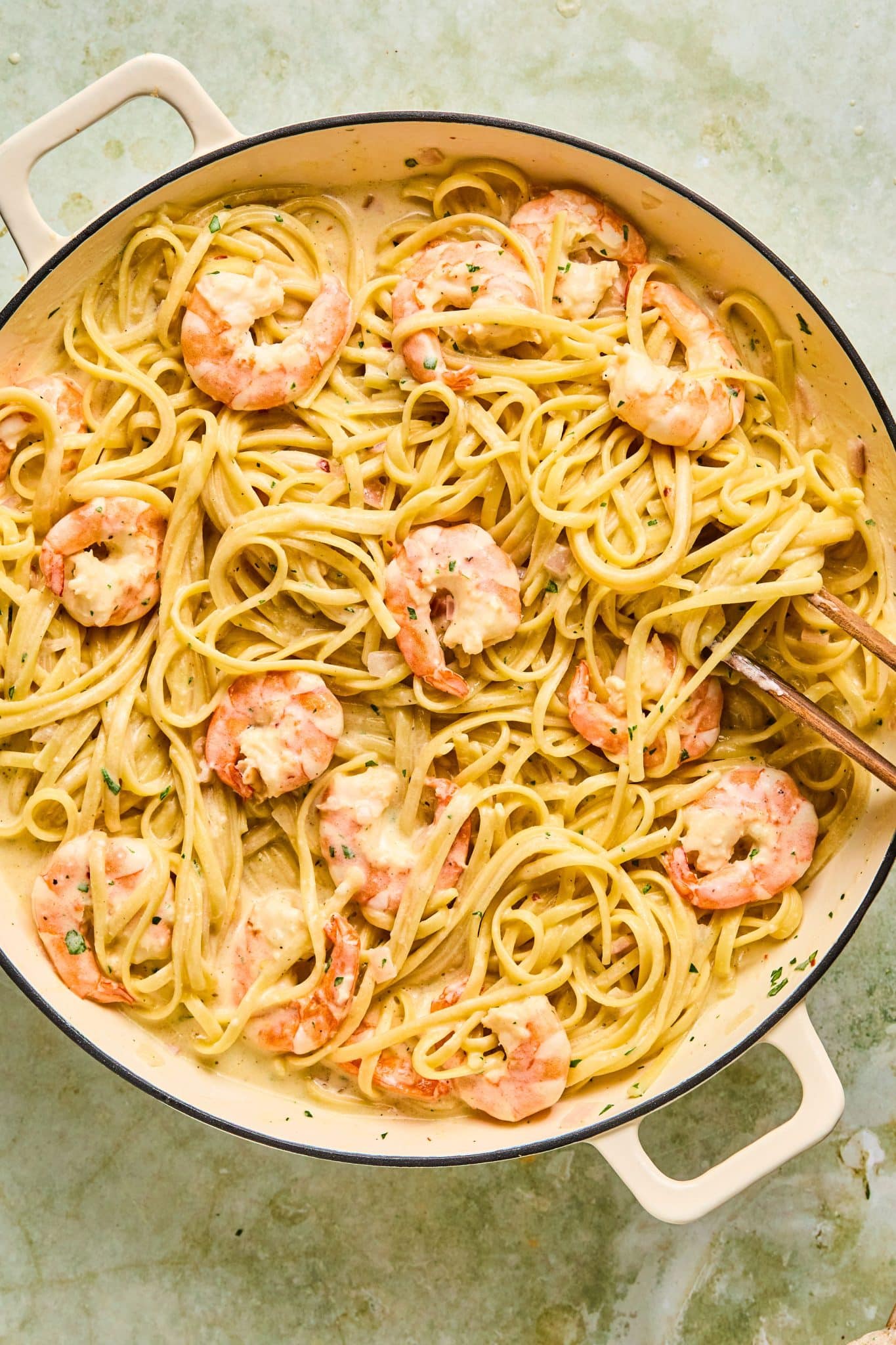 shrimp scampi alfredo in a white pot. 