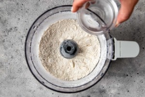 kitchen aid with flour and water being poured in