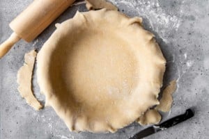 pie dough draped over a pie pan