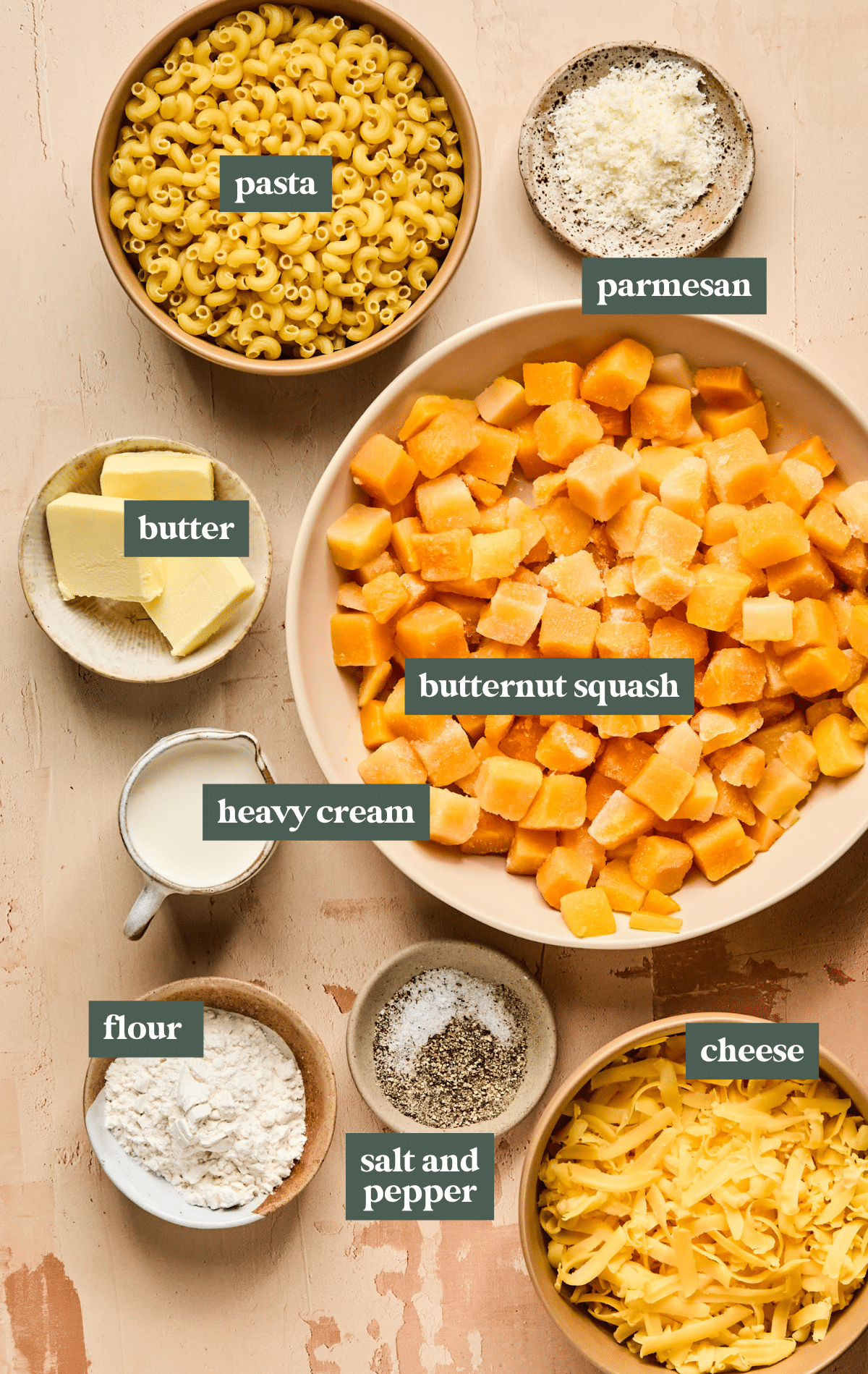 ingredients in small bowls needed to make butternut squash mac and cheese, 