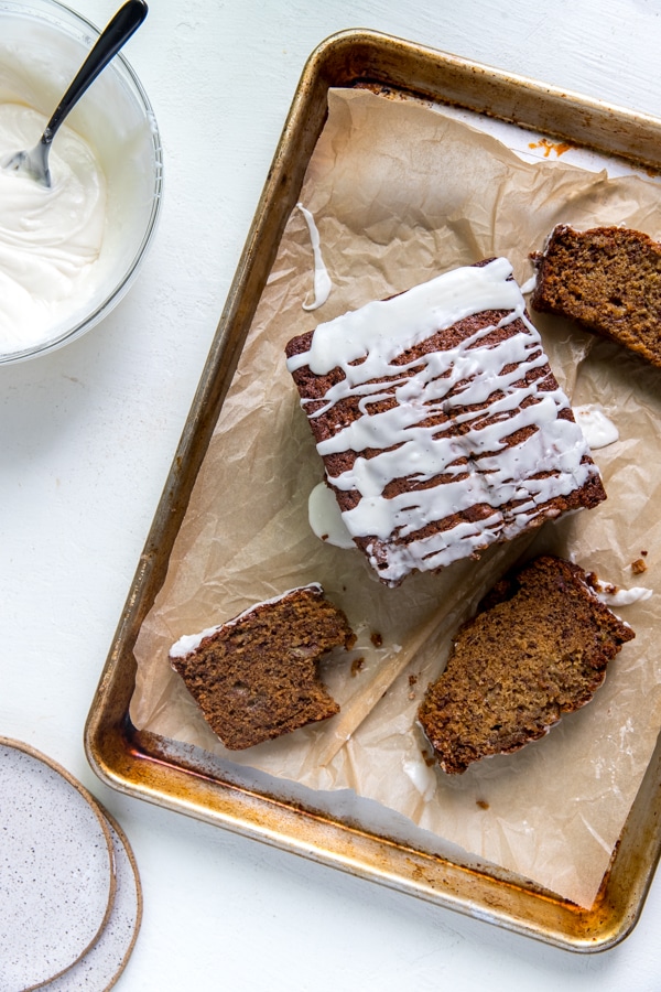 banana rum bread on a baking sheet lined with parchment paper