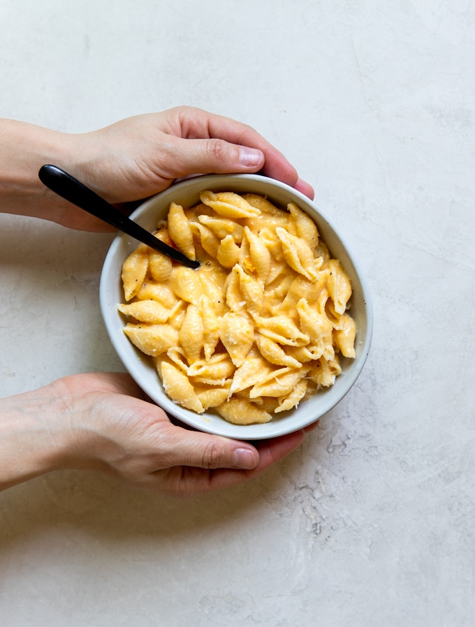 mac and cheese in a white bowl made with butternut squash